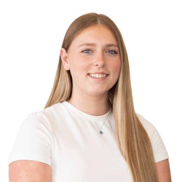 Smiling woman with long hair wearing a white shirt.